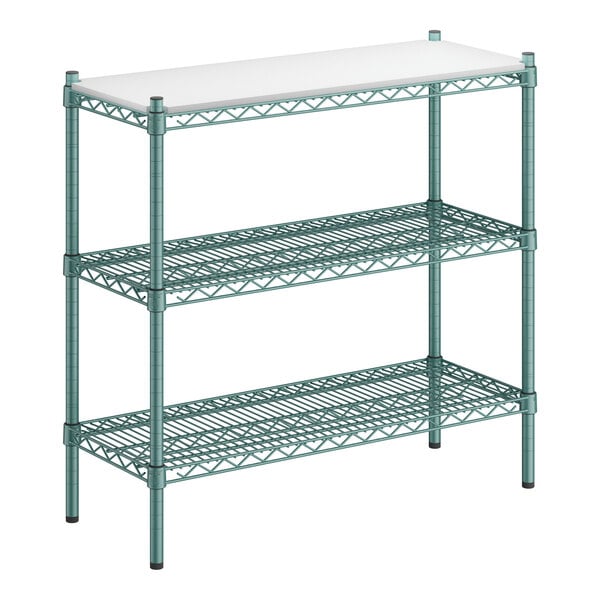 A green metal Regency shelving unit with white rectangular shelves.
