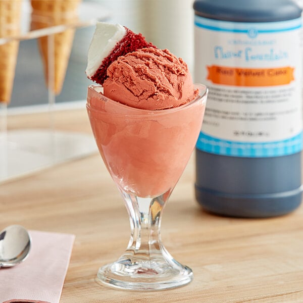 A glass of red velvet ice cream with LorAnn Red Velvet flavoring syrup on top.