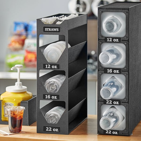 A black ServSense countertop organizer with sections for lids and straws.