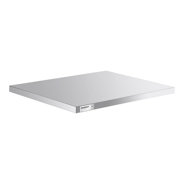 A rectangular, flat, metallic shelf with a smooth reflective surface and a small label on the front edge.