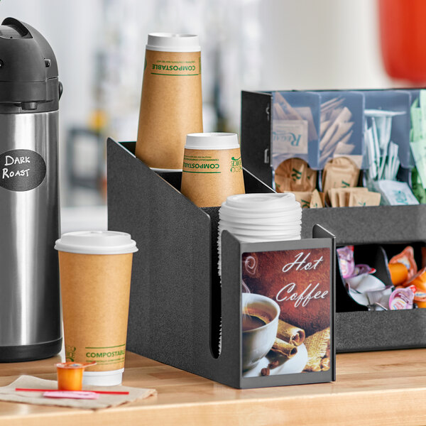 A ServSense black countertop cup and lid organizer with coffee cup decals.