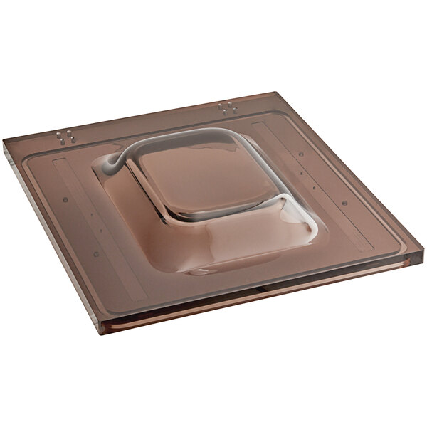 A VacPak-It Ultima lid on a brown square tray.