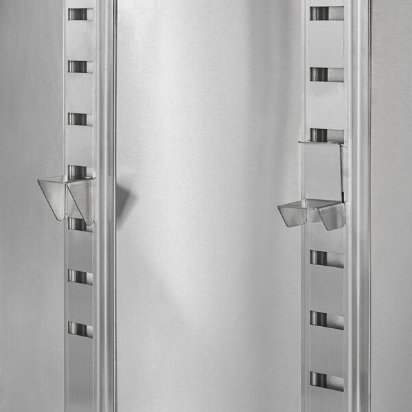 A silver rectangular Regency midshelf with two shelves and a handle.