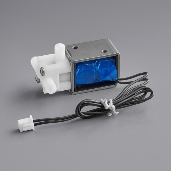 A small blue and white VacPak-It solenoid valve with a wire.