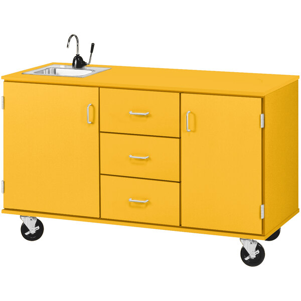 A sun yellow Demonstration Station with sink, drawers, and storage cabinets on wheels.