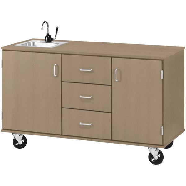 An I.D. Systems demonstration station with sink, drawers, and storage cabinets on wheels.