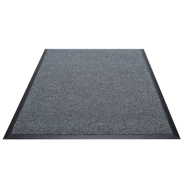 A grey carpet with a black border.