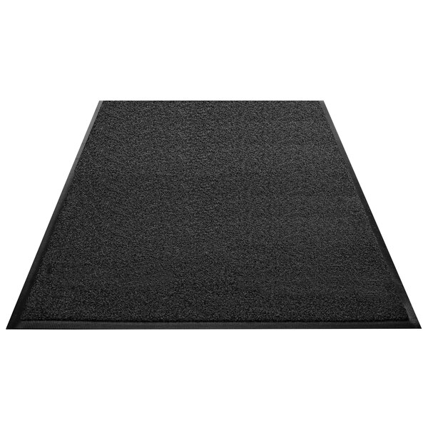 A black rectangular carpet with a black border and rubber backing.