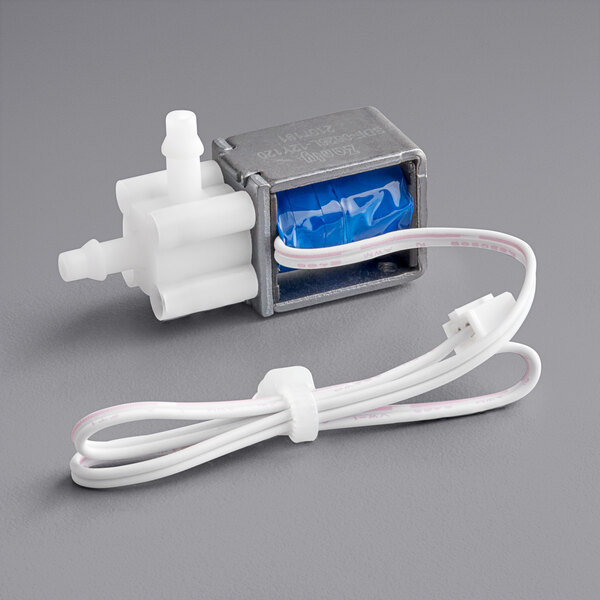 A small electric pump with a wire on a white background.