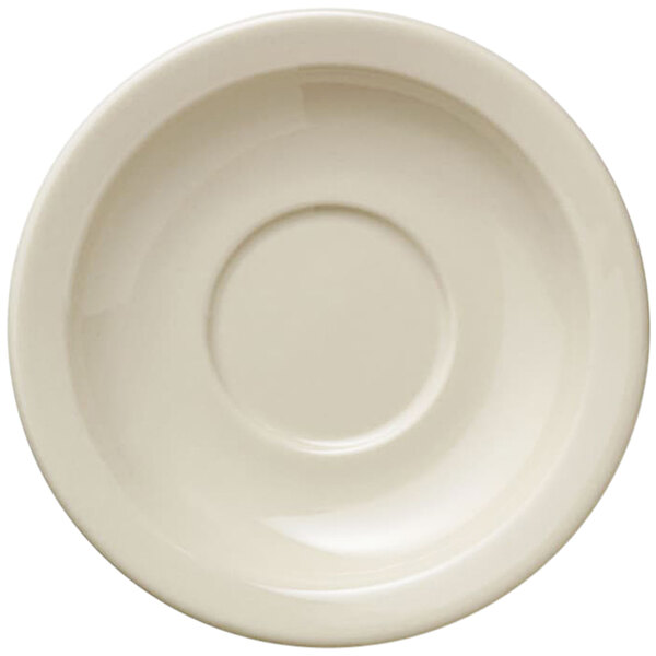 A Libbey Porcelana cream white saucer with a narrow rim.