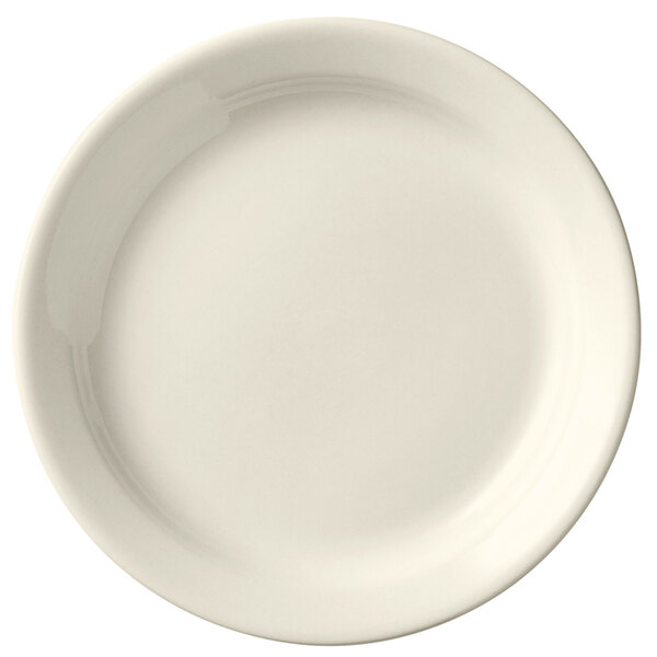 A Libbey Porcelana cream white porcelain plate with a plain edge.