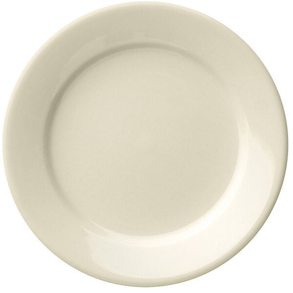 A close up of a Libbey Porcelana cream white porcelain plate with a plain edge.