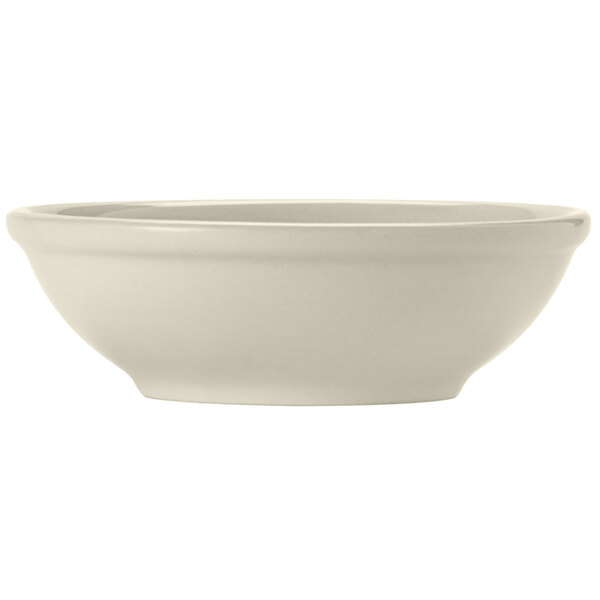 A white Libbey Porcelana fruit bowl with a rolled edge.