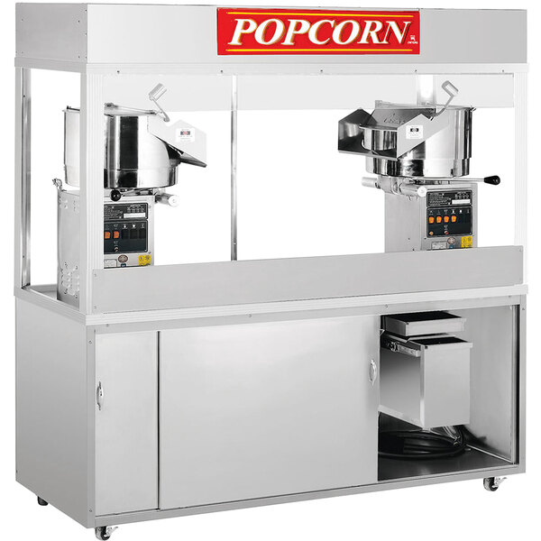 A Cretors floor model popcorn popper machine with two kettles.