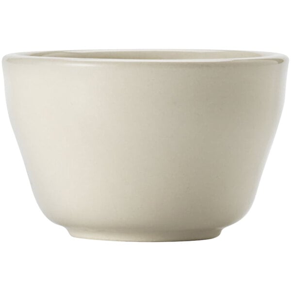 A Libbey Porcelana white porcelain bouillon bowl with a rolled edge on a white surface.