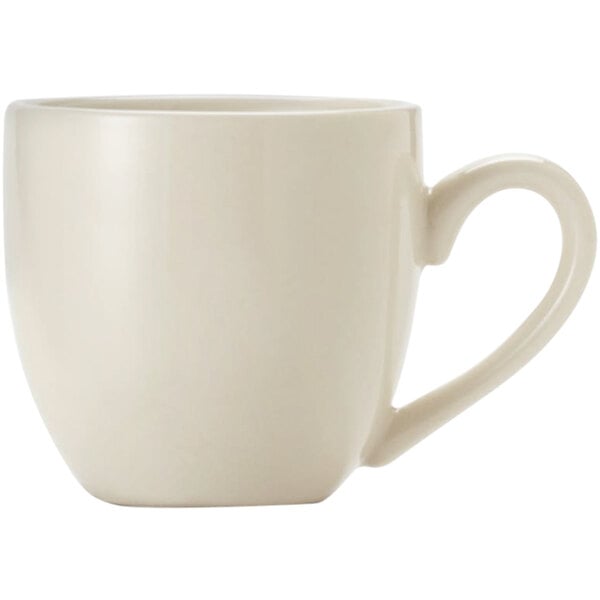 A close-up of a Libbey Porcelana white porcelain espresso cup with a handle.