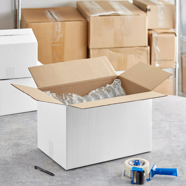 A Lavex white corrugated shipping box on a table.