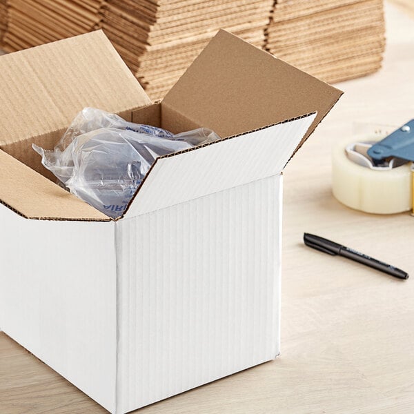 A white Lavex shipping box with a plastic bag inside.