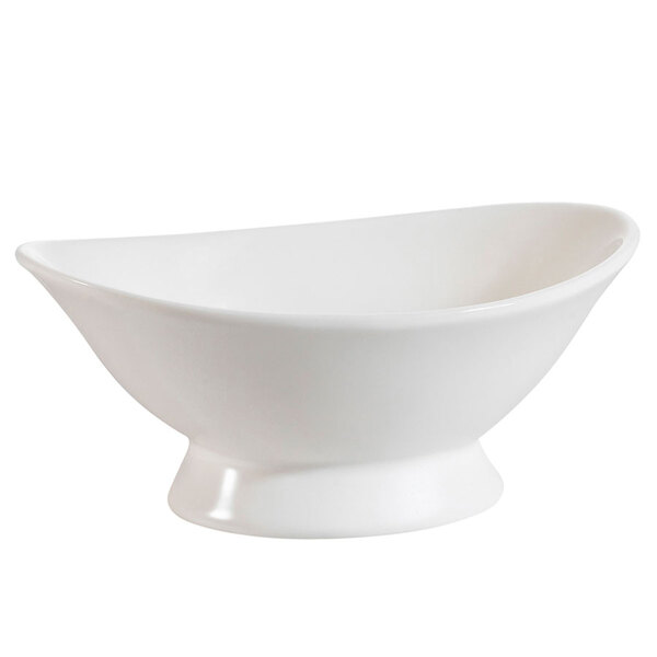 A CAC bone white oval porcelain bowl with a small base.
