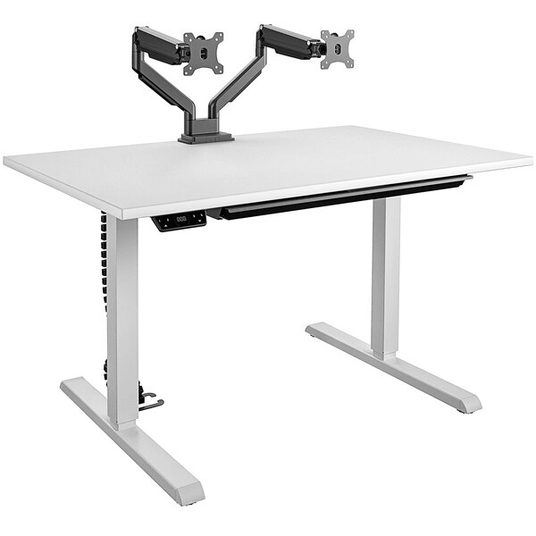 A white Bridgeport Pro-Desk with black dual monitor arms on it.