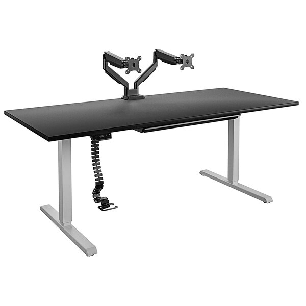 A black Bridgeport pro-desk with a black dual monitor arm on top.