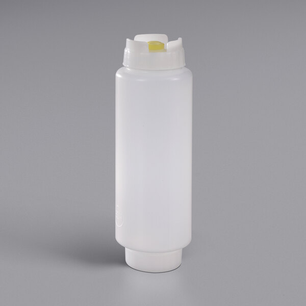 A white plastic bottle with a yellow cap.
