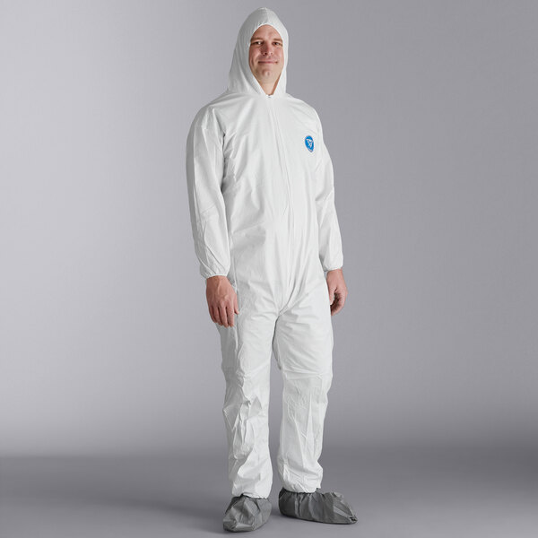 A man wearing a white Malt Impact ProMax coverall with attached boots and hood.
