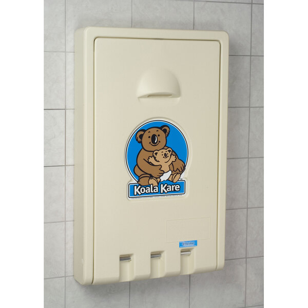 A white plastic Koala Kare baby changing station with a koala bear logo on it.