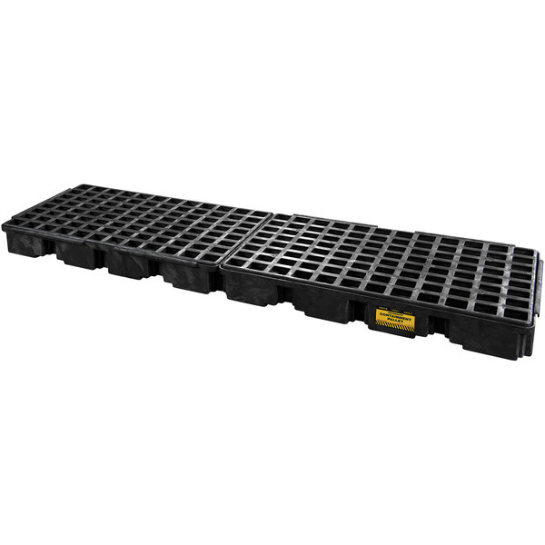 A black plastic pallet with rows of holes.