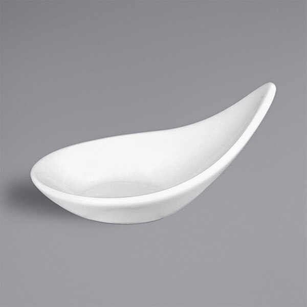 A white bowl with a curved teardrop shape on a grey background.
