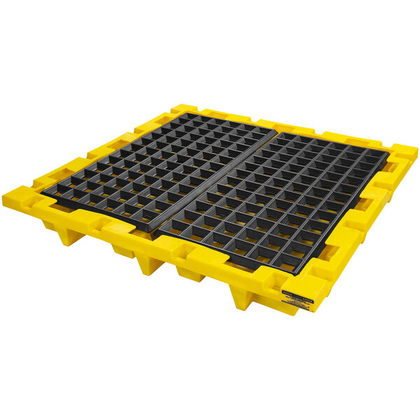 A yellow plastic Eagle Manufacturing pallet with a black grate.