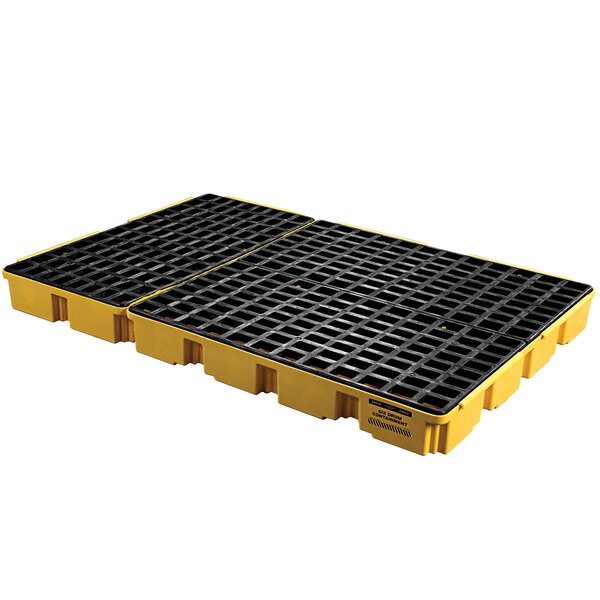 A yellow pallet with black grates.