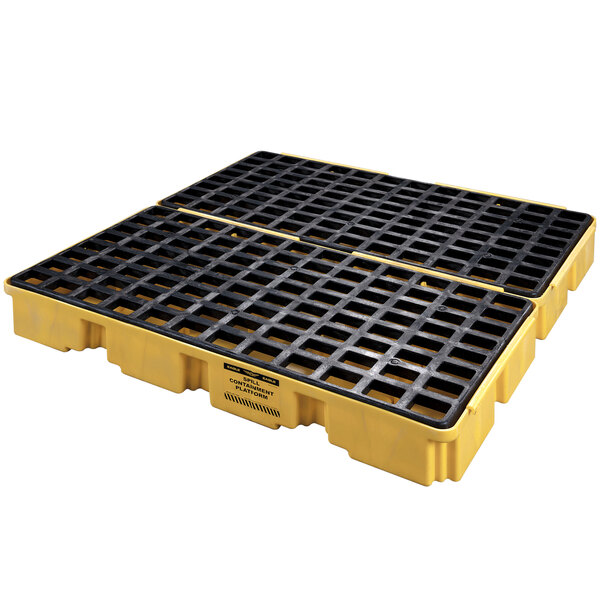 A yellow and black Eagle Manufacturing spill containment platform with black squares.