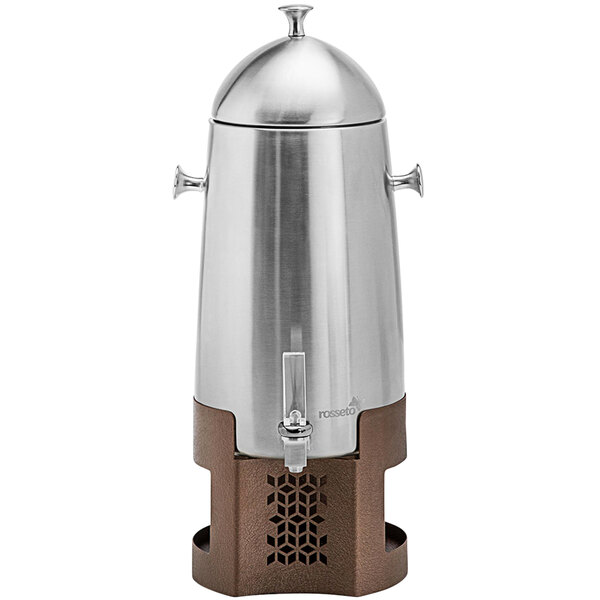 A silver metal Rosseto coffee urn with a lid on a brown and silver mosaic base.