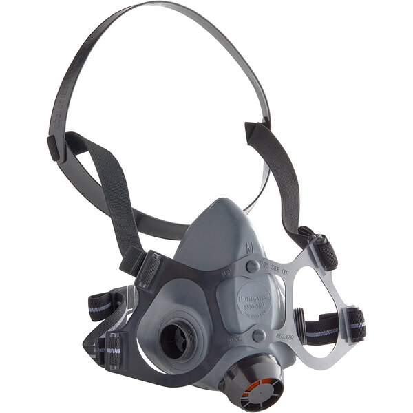 A grey and black Honeywell North 5500 Series half mask respirator with black straps.
