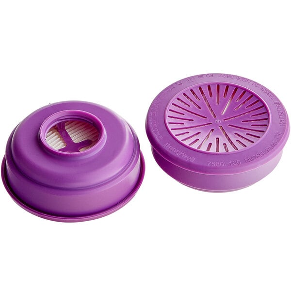 A purple Honeywell P100 particulate filter pack with two round filters and a round hole in the center.
