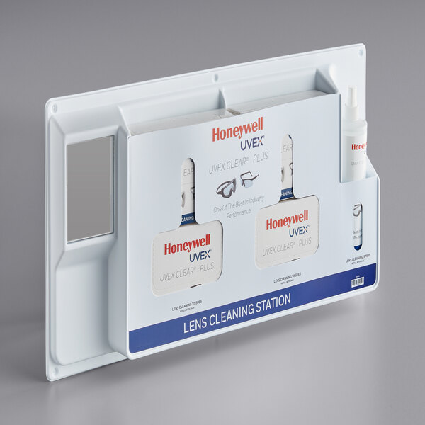 A white box labeled "Honeywell Uvex Clear Plus Deluxe Cleaning Station" containing lens cleaning products.