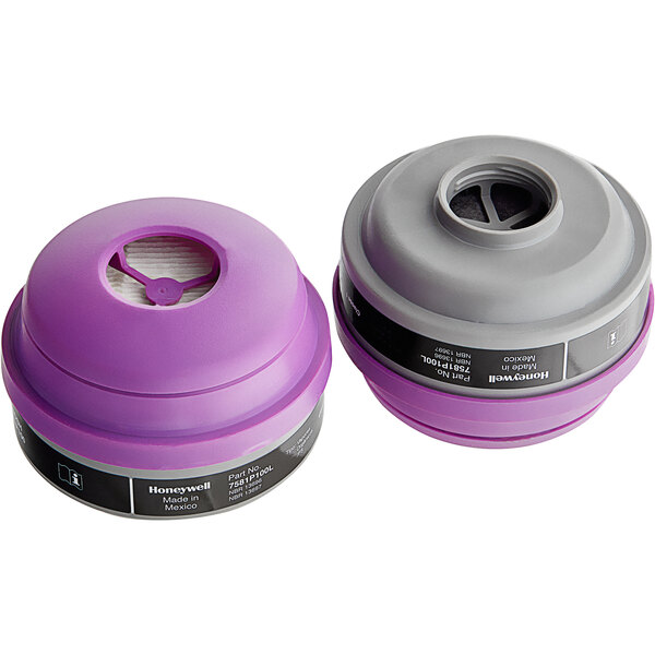 Two purple and gray Honeywell N-Series organic vapor cartridges with P100 particulate filters.