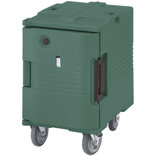 A green Cambro Ultra Pan Carrier with casters.