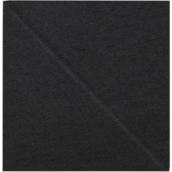 A close-up of a black cloth square with a cross pattern.
