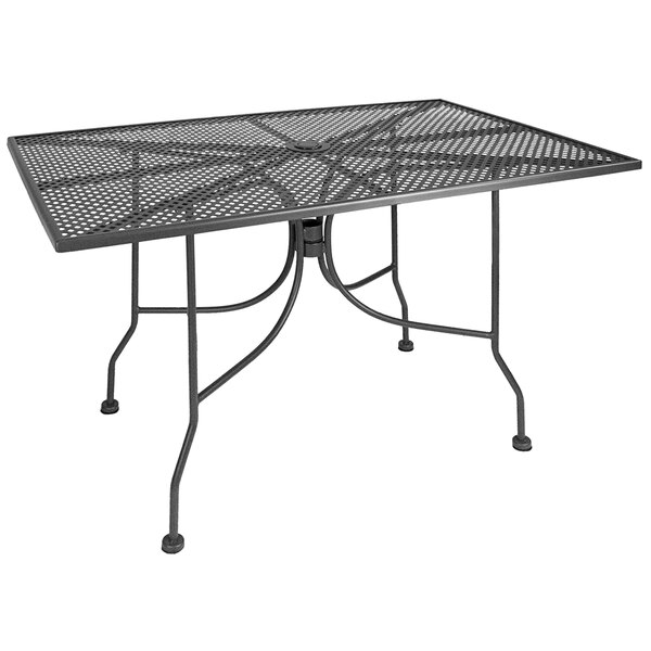 An American Tables & Seating dark grey metal mesh table with a metal frame and an umbrella hole.