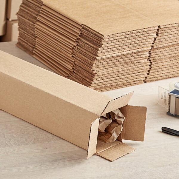 A stack of Lavex kraft cardboard shipping boxes.