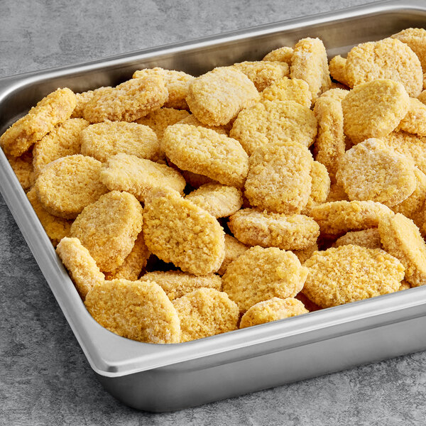 A metal tray filled with Impossible Foods Vegan Plant-Based Chicken Nuggets.