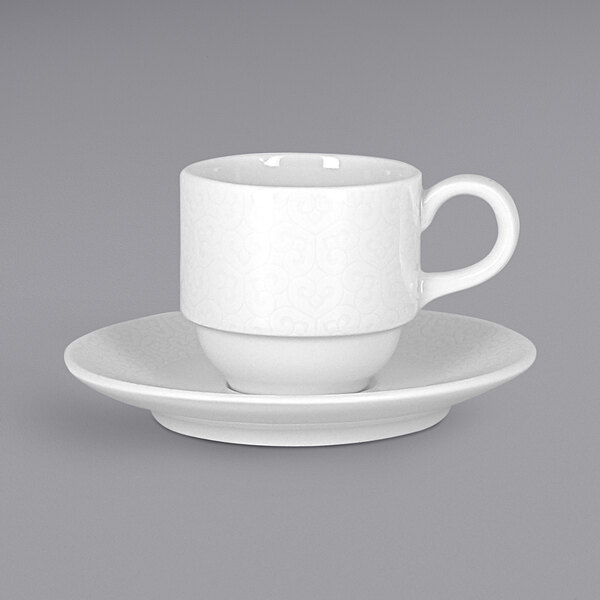 A RAK Porcelain ivory espresso cup and saucer on a grey surface.