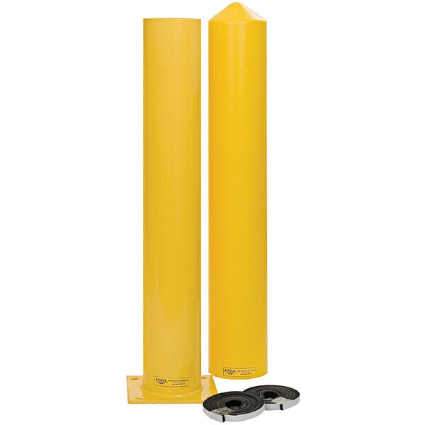 A yellow steel bollard post with a black cap and sleeve.