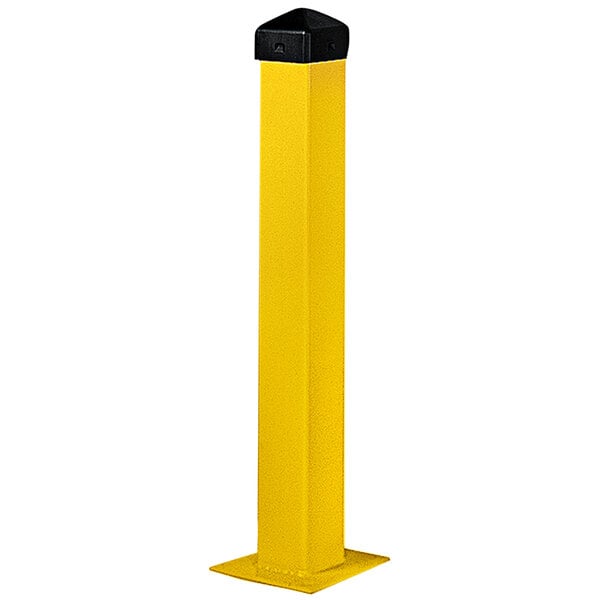 A yellow rectangular steel bollard post with a black cap.