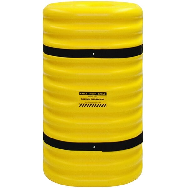 A close up of a yellow cylinder with black bands.