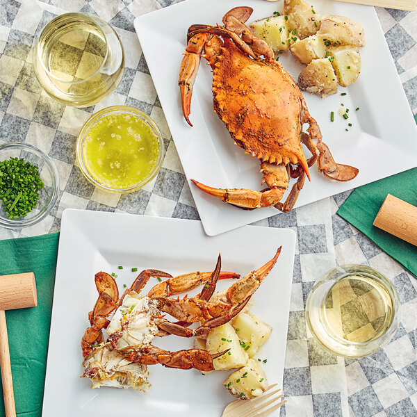 A plate of Chesapeake Crab Connection female blue crabs with potatoes on a table.