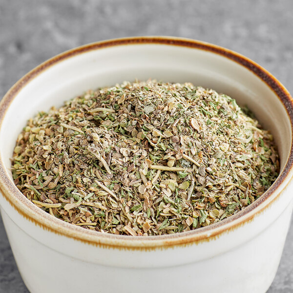 A bowl of Regal Greek Seasoning, a mix of dried herbs.