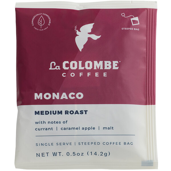 A red and white La Colombe Monaco Blend single serve coffee bag on a counter.